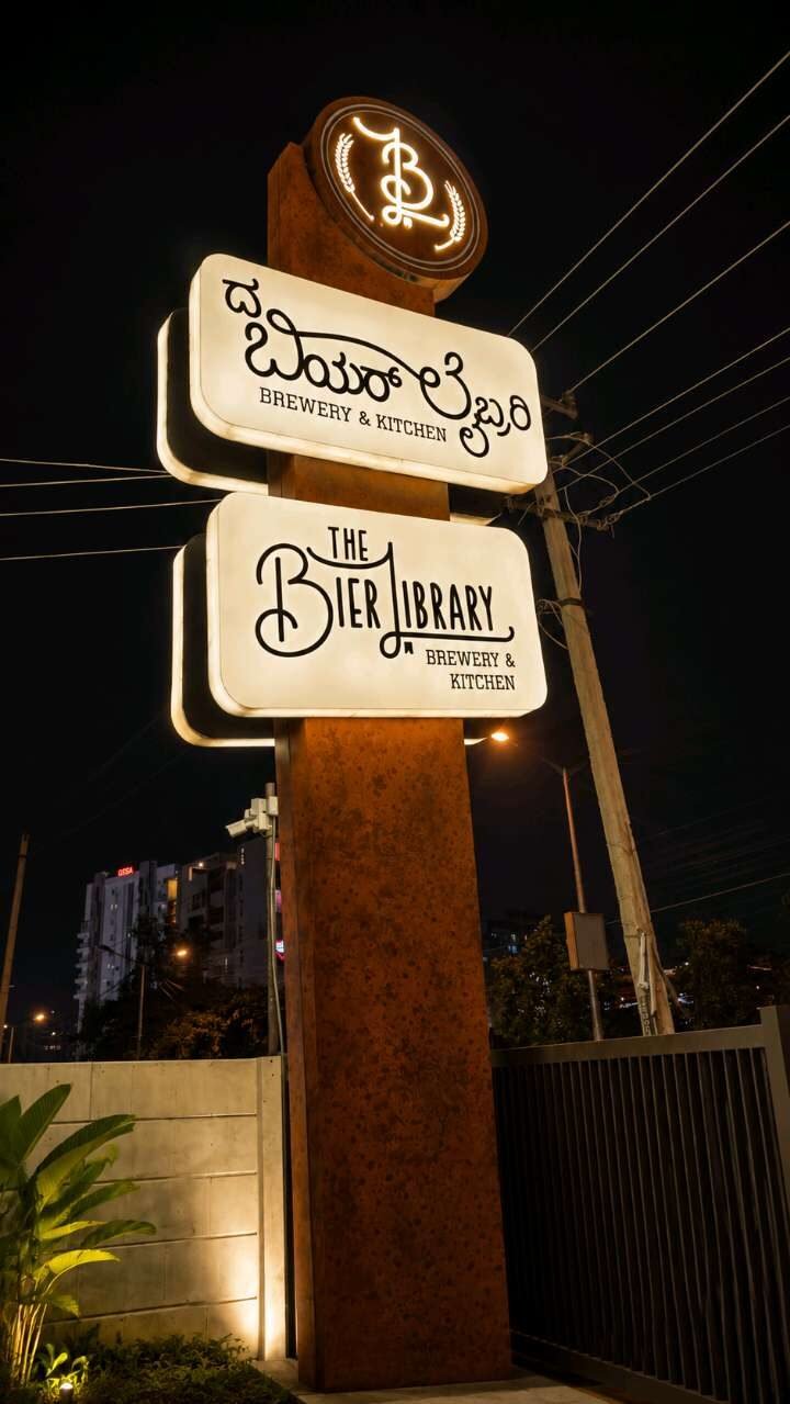 Illuminated pylon signage tower for a brewery and kitchen