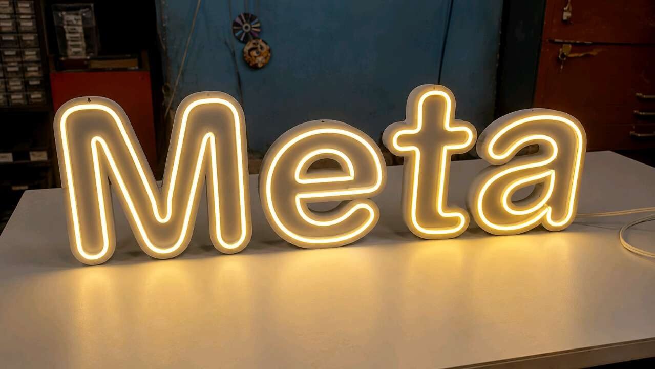 Finished neon-style LED letters lit up before dispatch