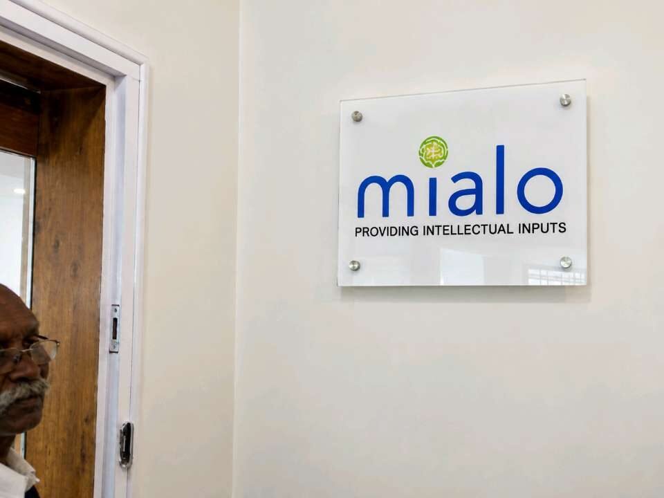 Frosted glass office signage panel mounted with stand-off fixings